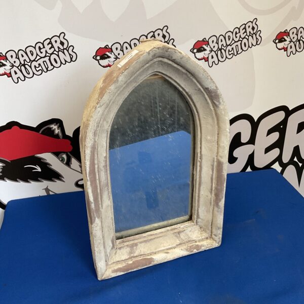 Vintage Gothic church window mirror with arched design.