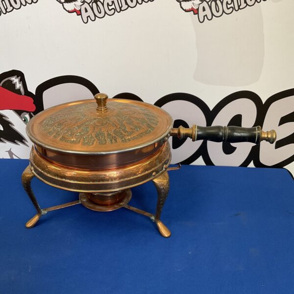 Ornate vintage middle eastern copper chaffing dish with embossed details.