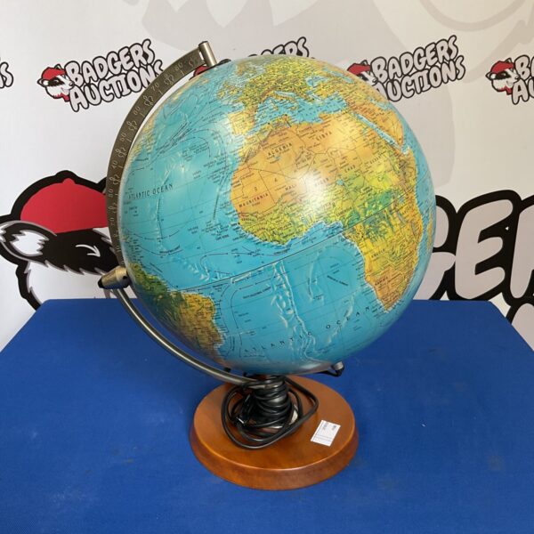 Vintage Scanglobe model X illuminated desktop globe on wooden base.