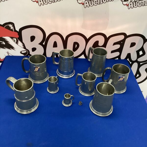 Set of four vintage pewter MG Car Club tankards.