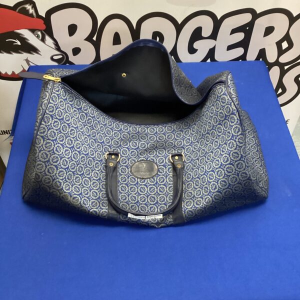 Vintage Silverstone British Racing Drivers Club bag with crest pattern.
