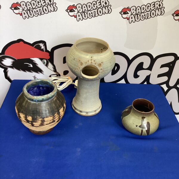 Two handmade pottery vases with rustic glaze.