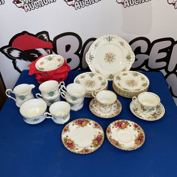 Vintage Royal Albert china tea set with floral designs.