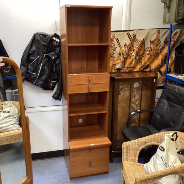 Tall wooden bookcase unit for home storage and display.