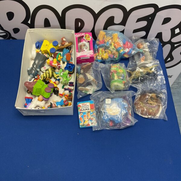 Vintage McDonald's toy collection featuring Disney and Grimace figures.