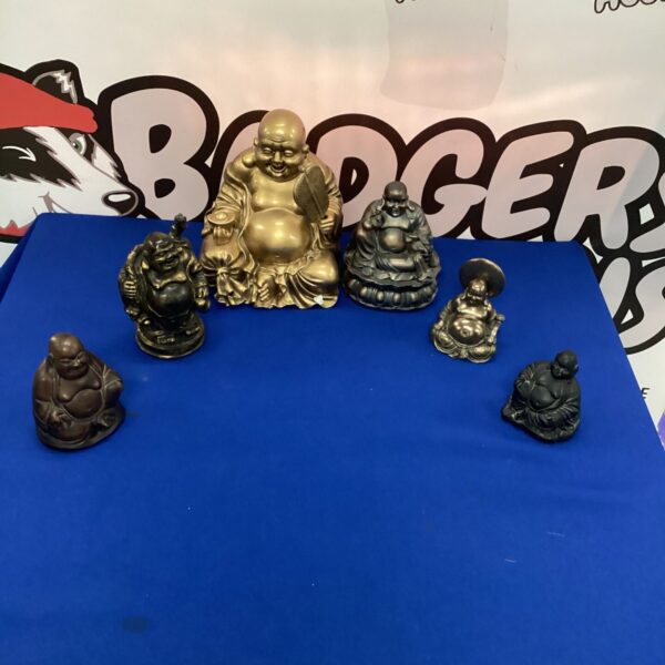 Golden Buddha figurines displayed as a collectible lot.