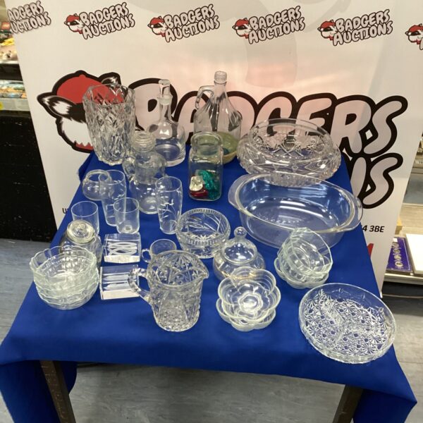 Mixed glassware lot with crystal vase and assorted glasses.