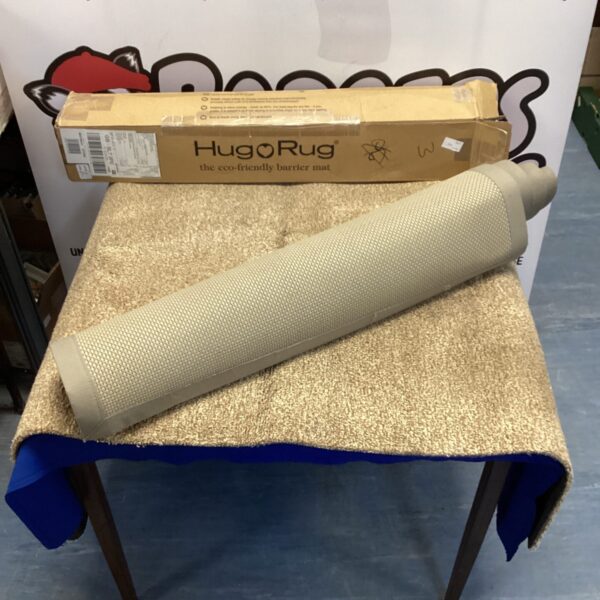 Pair of used Hug Rug eco barrier mats for doorway protection.