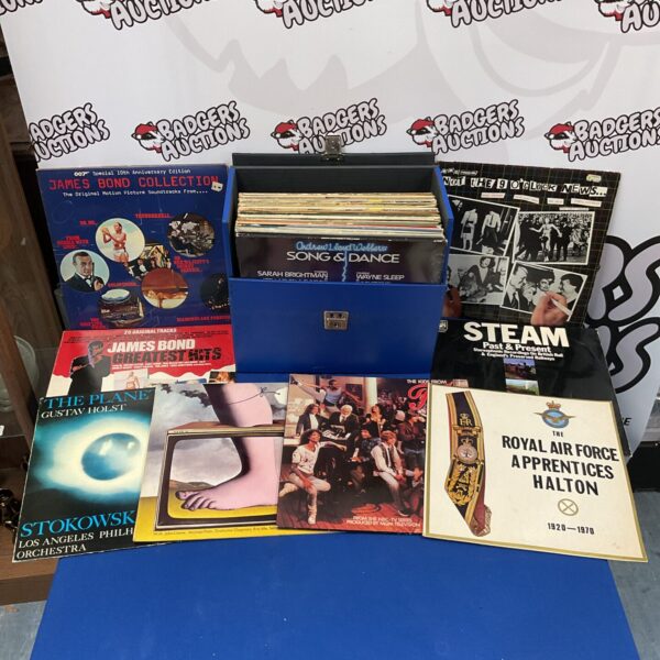 Collection of James Bond soundtrack vinyl records in a carrying case.
