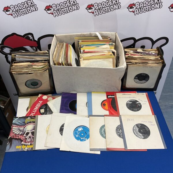 Vintage collection of 7 inch vinyl records for collectors.