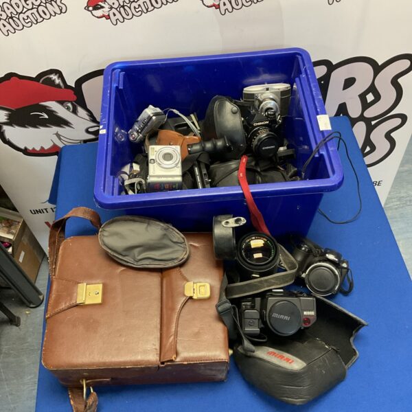 Vintage camera lot with a Chinon camera and various accessories.