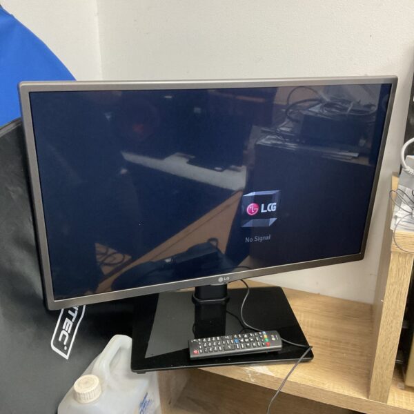 LG 28" 4K smart TV with remote control on display.