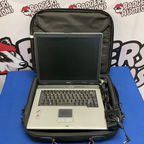 Vintage Acer Travelmate 4050 laptop with carrying case and power supply.
