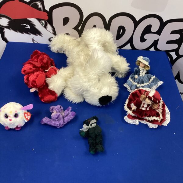 Assortment of colourful soft toys and a plush dog.