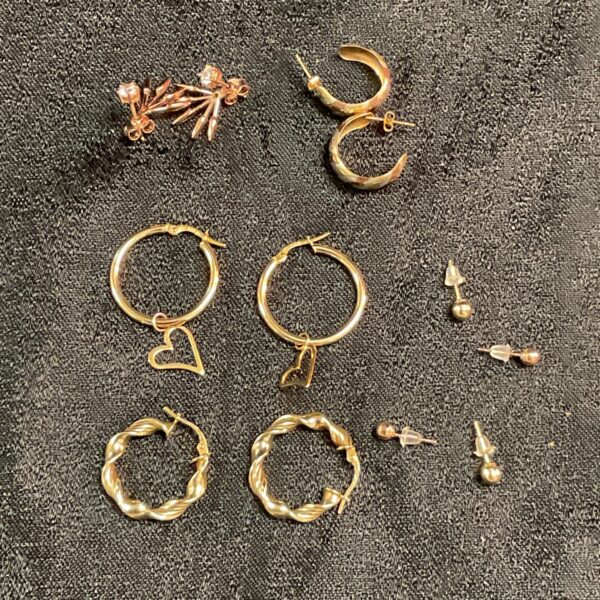 Close-up of 9ct gold and silver earring collection.