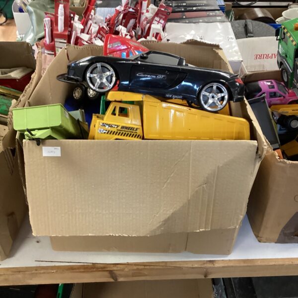 Mixed lot of toy vehicles including a Porsche and construction trucks.
