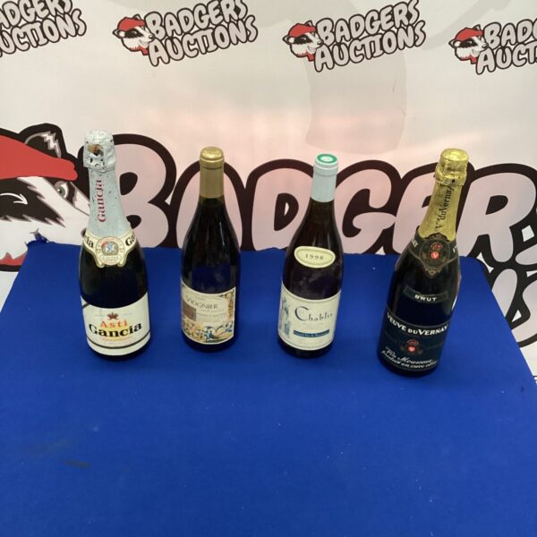 Mixed lot of alcohol bottles including Chablis wine.