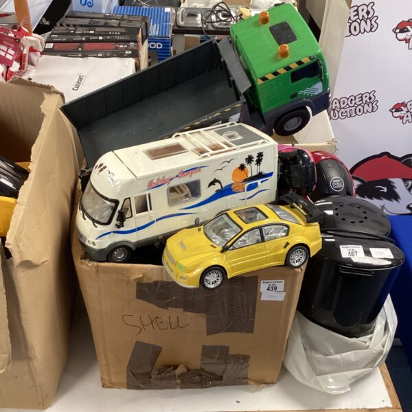 Toy car lot featuring a campervan and construction trucks.