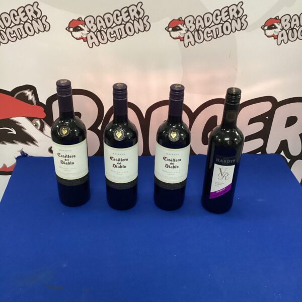 Lot of four Merlot wine bottles for sale.
