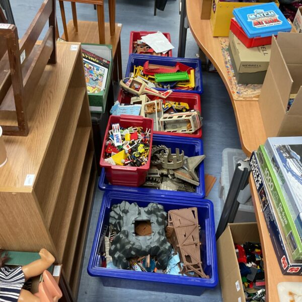 Large lot of vintage Playmobile figures and sets in storage boxes.
