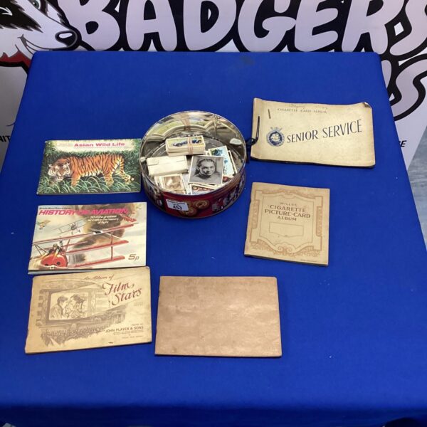Vintage cigarette cards and albums, a collectible lot for enthusiasts.