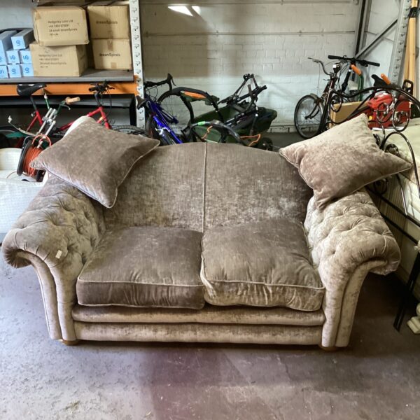 Plush velvet Chesterfield sofa, two-seater, vintage style.