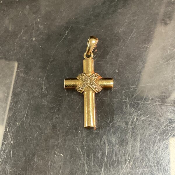 Hallmarked 9ct gold cross pendant with textured finish.