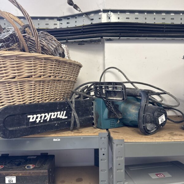 Vintage Makita electric chainsaw in used condition, ideal for garden work.