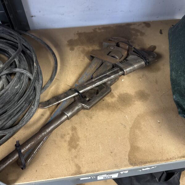 Vintage Stilson grips and thread tapping spanner for plumbing work.