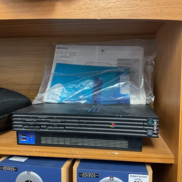 Black Sony PlayStation 2 console for retro gaming.