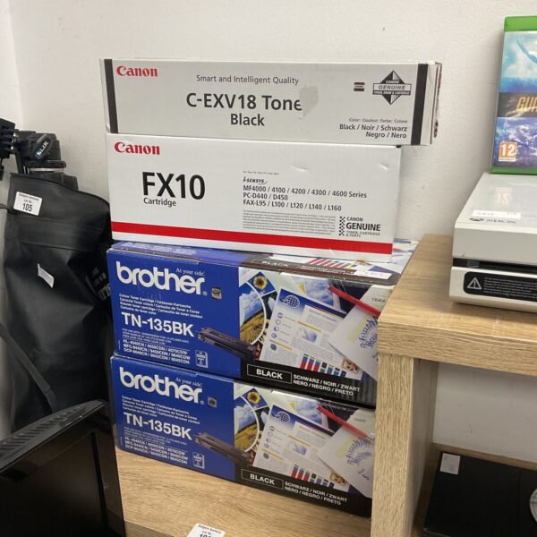 Four new Canon and Brother printer toner cartridges in original packaging.
