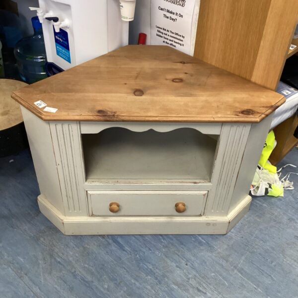 Vintage pine corner unit with shelf and cupboard for display.