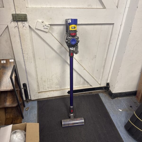 Front view of a Dyson V8 cordless vacuum cleaner.