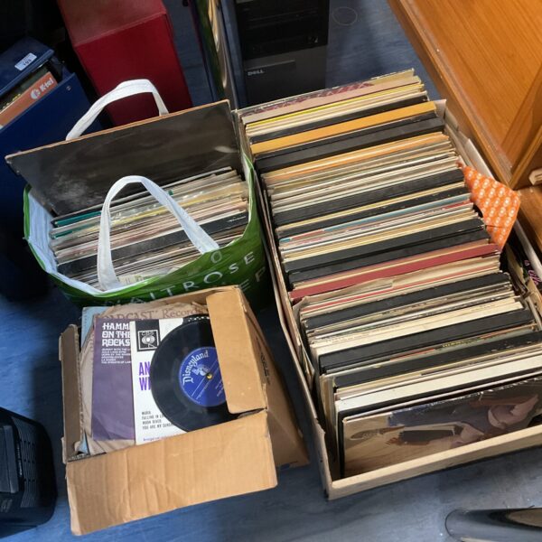 Large lot of vintage vinyl records in boxes and a tote.