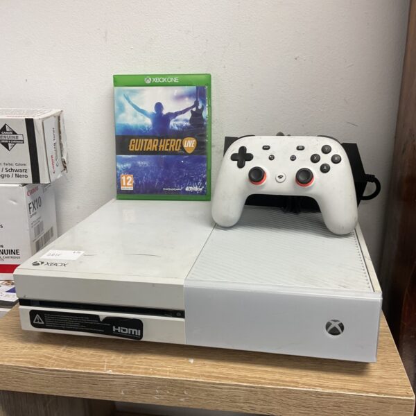 Microsoft Xbox One console with controller and game presented for auction.