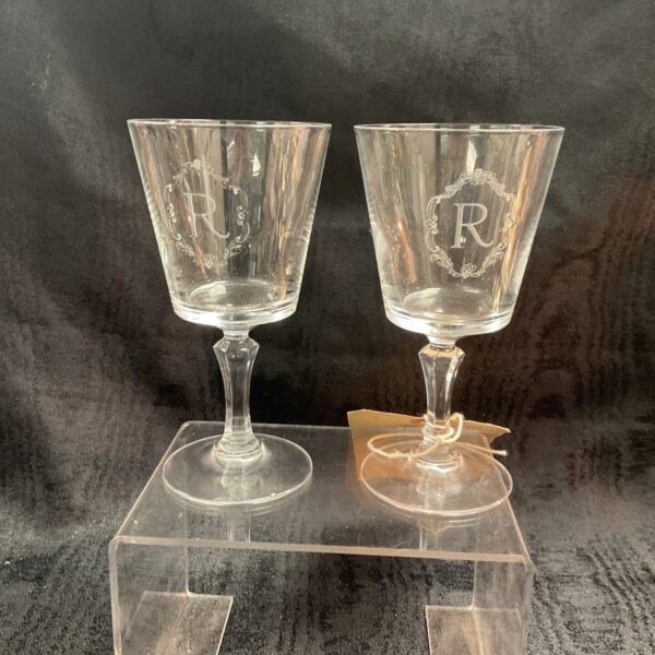 Pair of engraved lead crystal wine goblets with letter R.