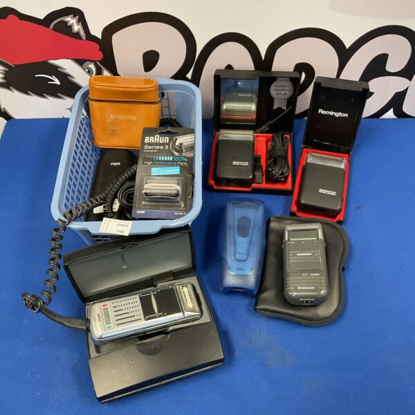 Vintage Remington and Braun electric shavers in a lot.