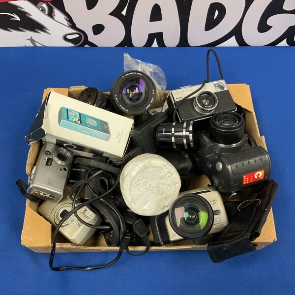 Vintage camera lot featuring Olympus and Minolta film cameras.