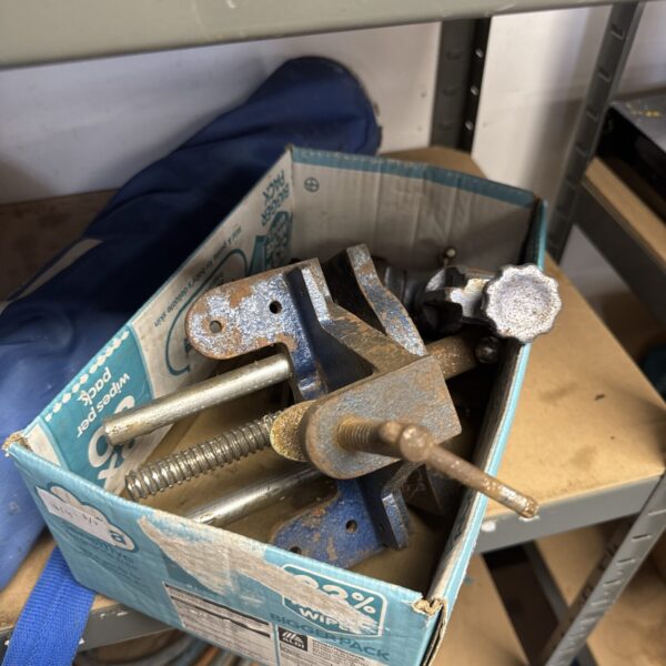 Selection of vintage bench vices for metalworking and repair.