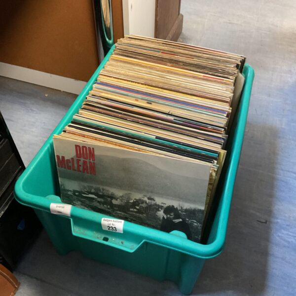 Large crate filled with a diverse collection of vinyl records.