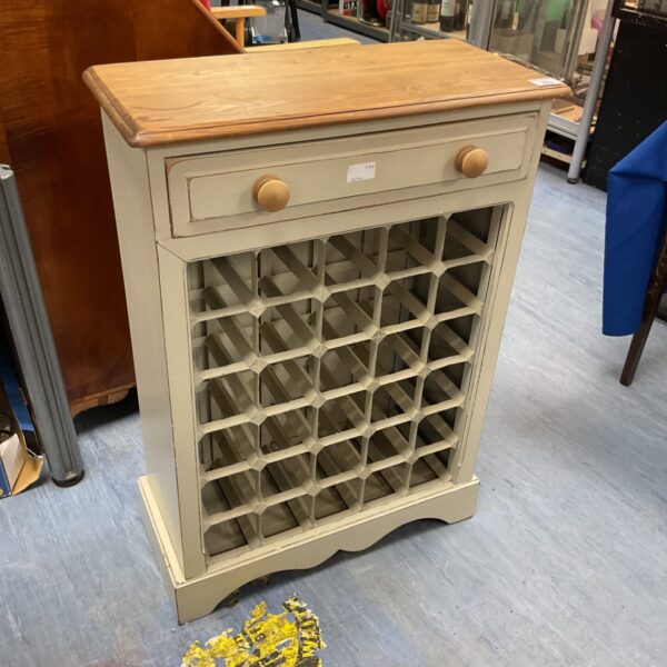 Distressed shabby chic pine wine rack with bottle storage.