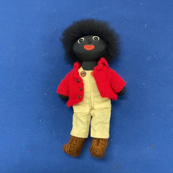 Front view of vintage Robin Rive Golly doll with red jacket.