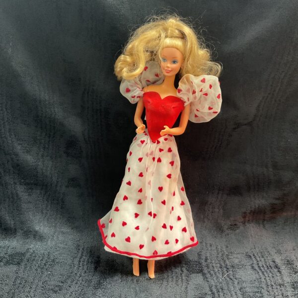 Vintage 1984 Loving You Barbie doll in pink heart dress.