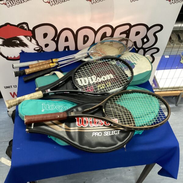 Selection of vintage tennis and badminton rackets for collectors.