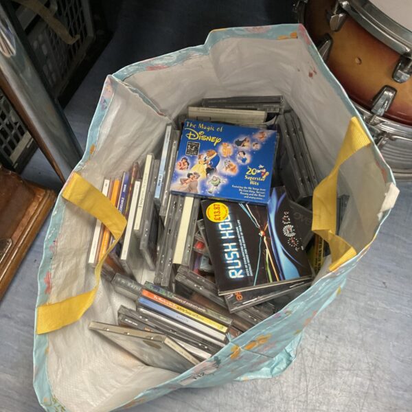Mixed lot of music CDs and cassette tapes for collectors.