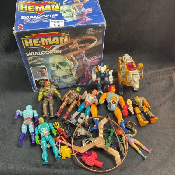 Vintage He-Man toy lot with G1 Transformers and assorted figures.