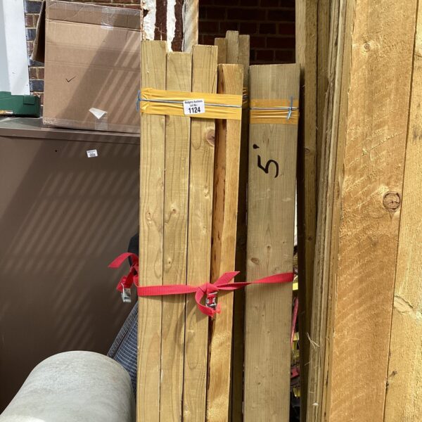 Strapped bundles of timber ready for construction or DIY projects.
