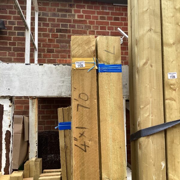 Stacked timber bundles ready for construction or DIY projects.