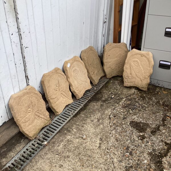 Six stone effect animal plaques for garden decoration.