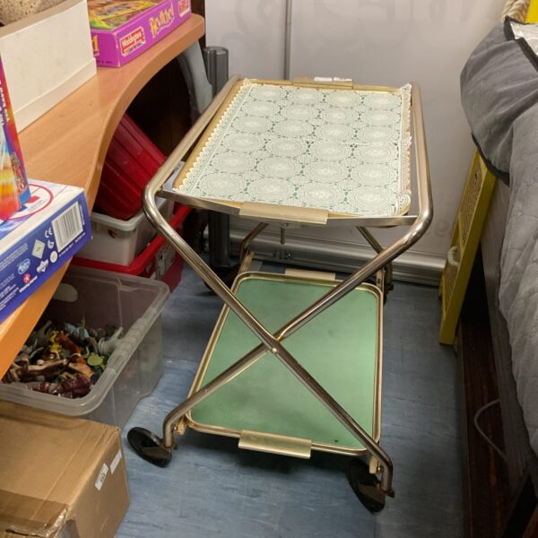 Vintage metal drinks trolley with laminate top, retro style.